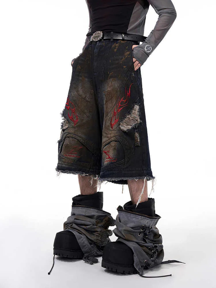Men's wide-leg jeans with detachable trouser legs showing convertible design
