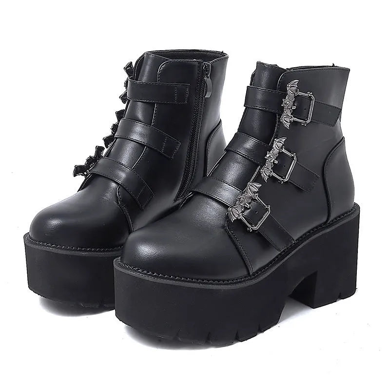 Black women's punk gothic ankle boots with bat buckle, side zipper, and chunky platform heel.