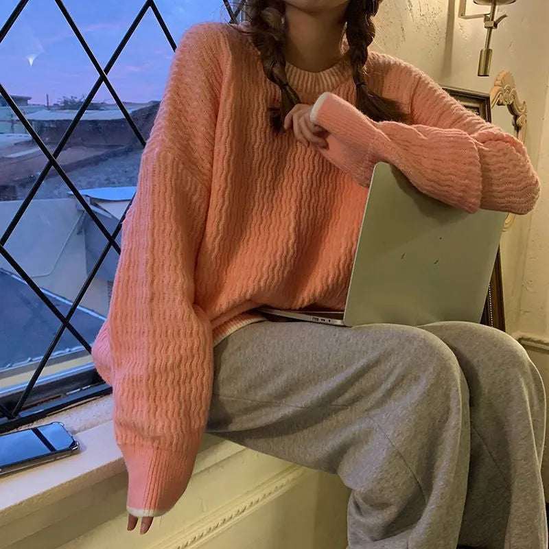 Women's loose retro pullover sweater in lake blue, purple and pink colours showing regular sleeves and medium thickness