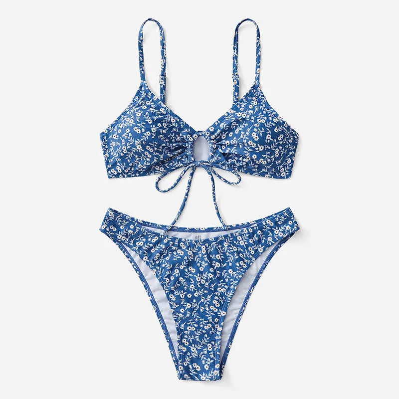 Blue women's swimsuit three-piece set with a top and shorts on a mannequin.