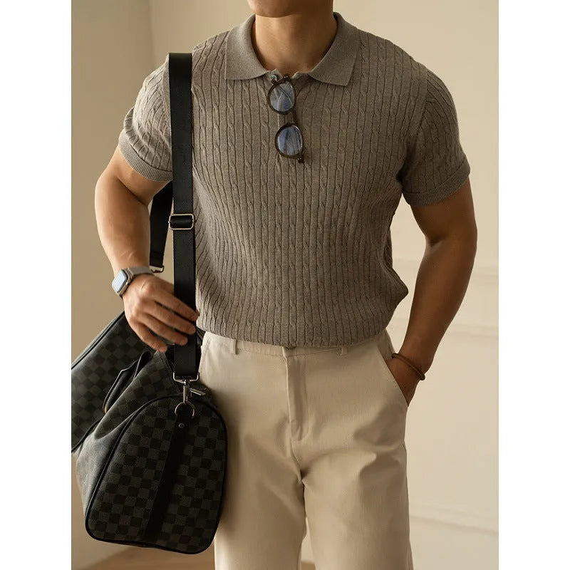 Men's khaki short sleeve business top laid flat, showing collar and button detail.