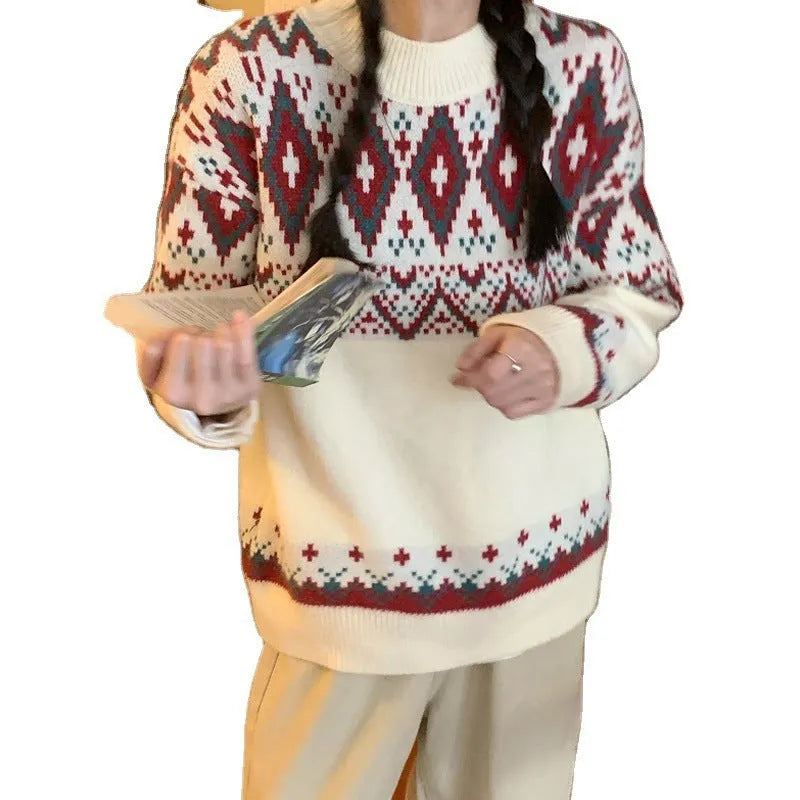 Red and white striped loose-fit long sleeve pullover knitted top on a hanger.