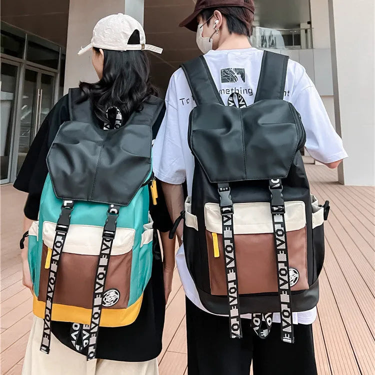Oxford cloth school backpack showing black, green and red colour options with handheld and shoulder straps