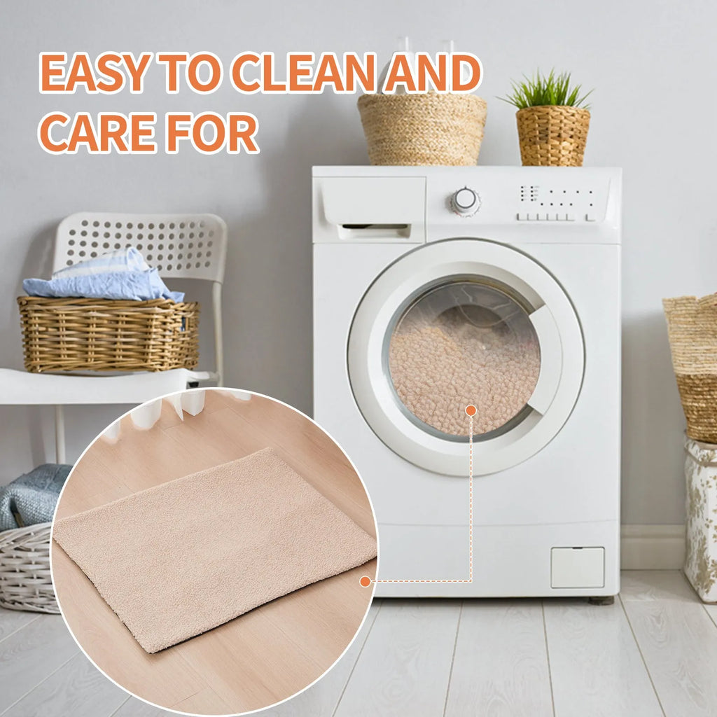 Grey self-heating plush pet pad for cats and dogs on a wooden floor.