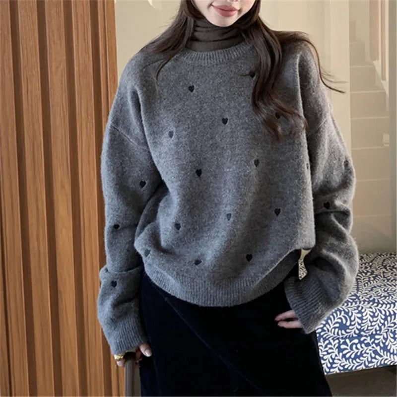 Women's loose long sleeve pink sweater with embroidered love pattern detail