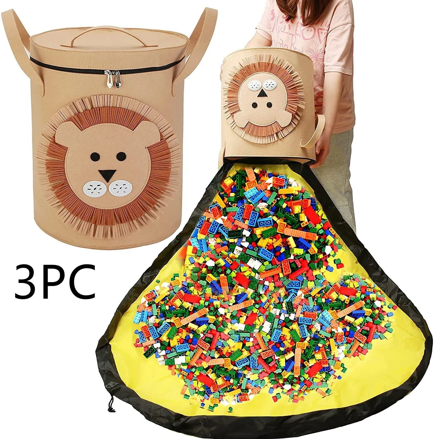 Green felt cube-shaped toy storage bag opened flat as a play mat next to toys, showing pull rope.