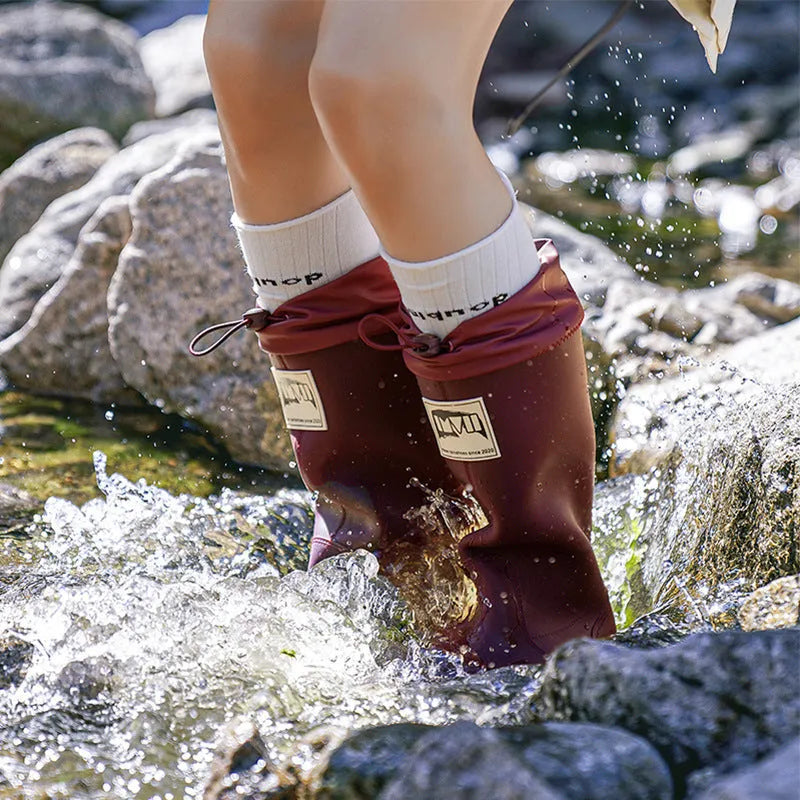 Pair of solid colour platform heel PVC wellington boots for men and women.