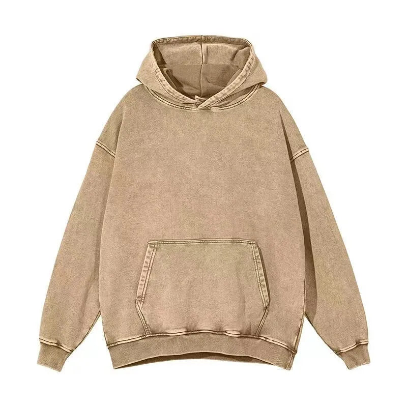 Men's loose-fit collarless hoodie in washed cotton with batik print, showing drop-shoulder sleeves.