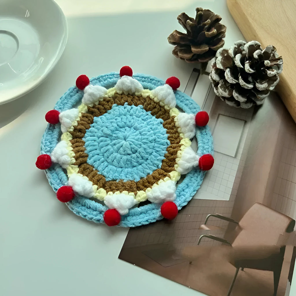 Handmade round wool coaster bag for hot mugs on a table