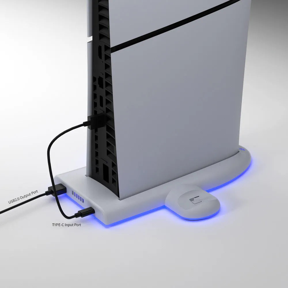 White PS5 Slim charging base with integrated USB charger and RGB ambient lights on a cooling pad.
