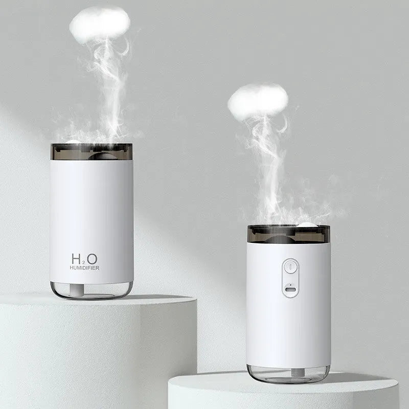 USB jellyfish humidifier producing smoke-ring mist with warm night light in blue, pink, or white colours