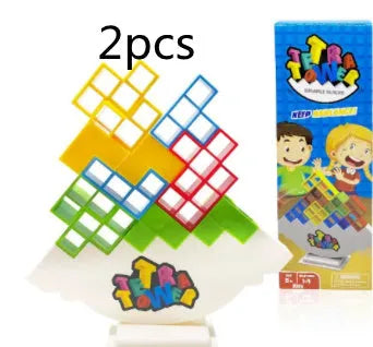 Plastic balance stacking board game with 16 colourful blocks, chassis, and base on a table.