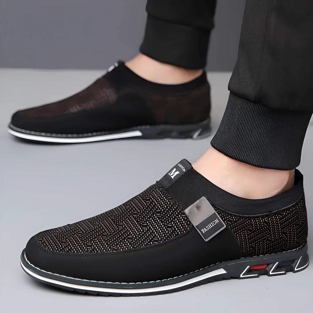 Men's grey and white synthetic leather flat casual shoes with a square toe and rubber sole.
