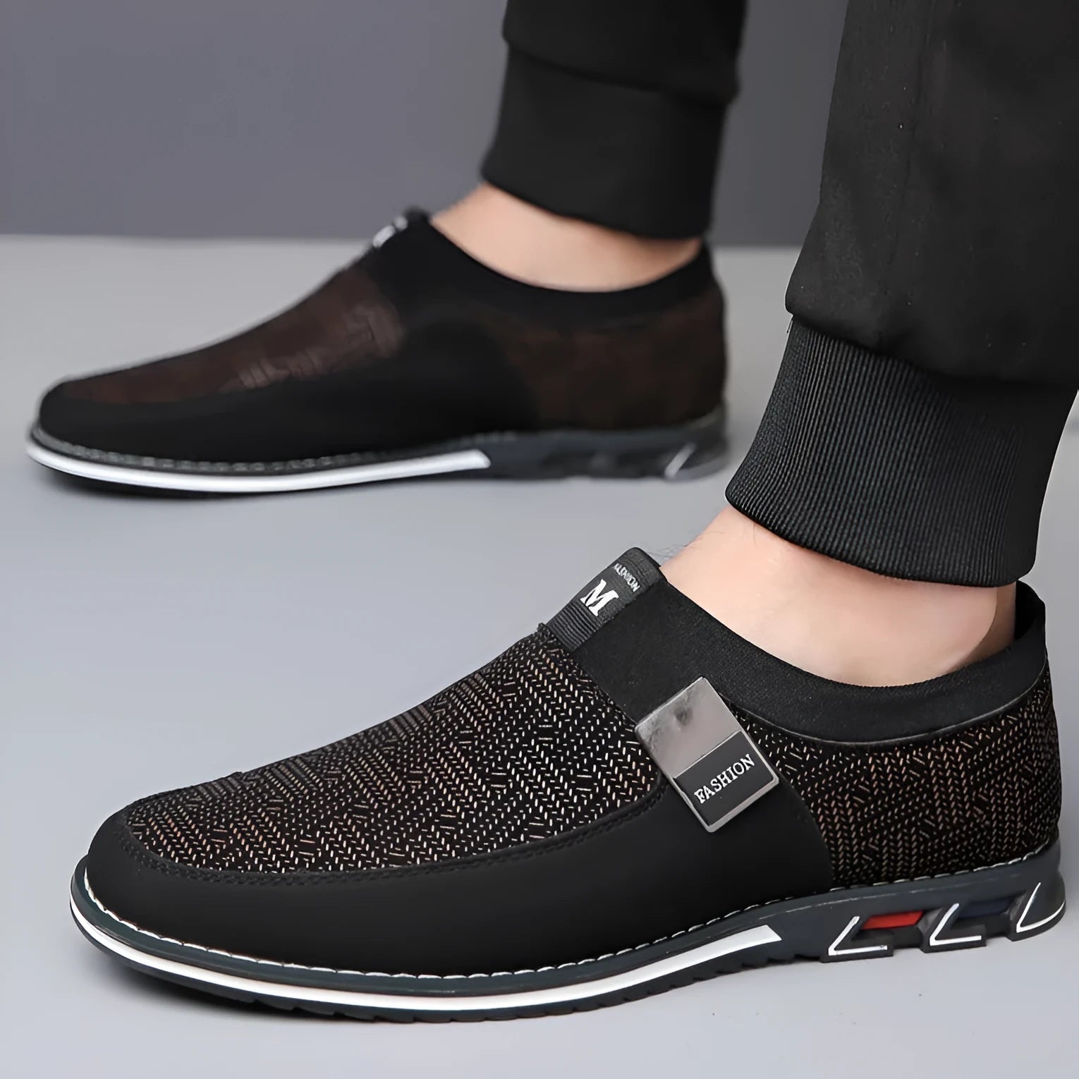 Men's grey and white synthetic leather flat casual shoes with a square toe and rubber sole.