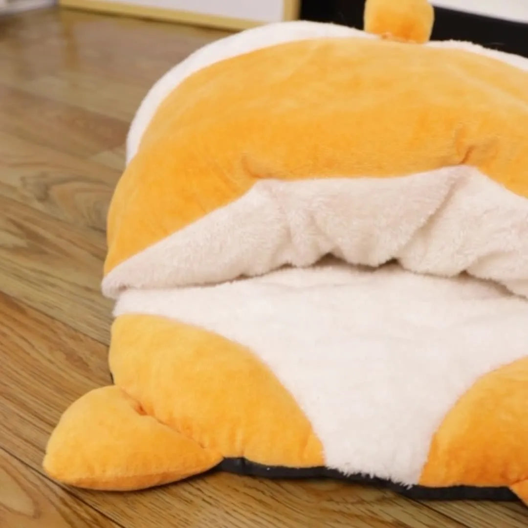 Orange semi-closed cat sleeping bag bed with integrated mat, 65cm long.