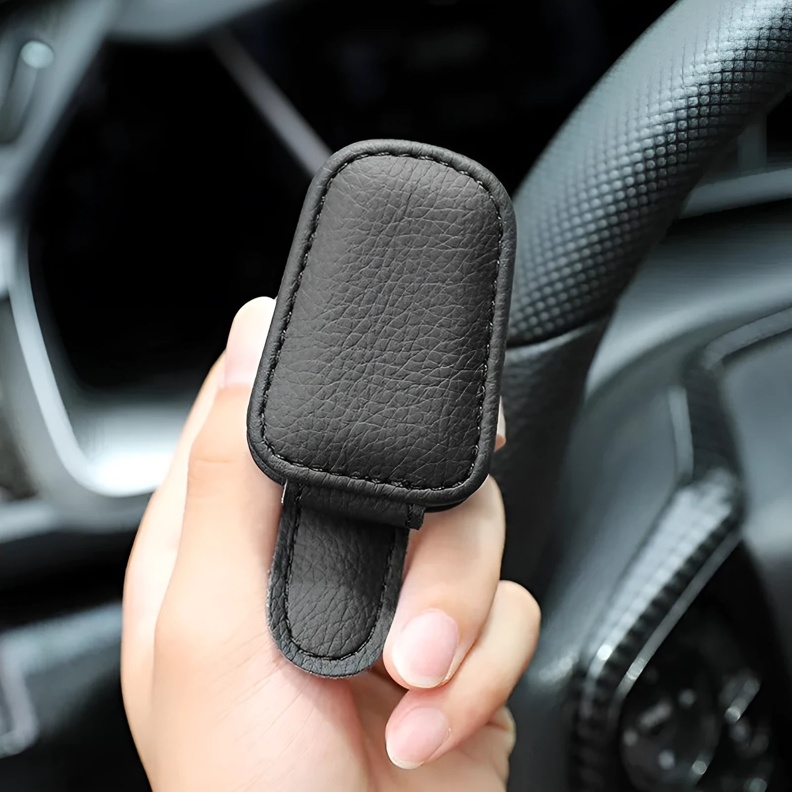 Car sunglasses clip with PU leather case attached to sun visor