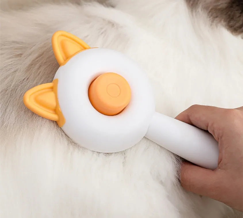 Self-cleaning pet grooming comb with massage function in greenish white or orange white colour options