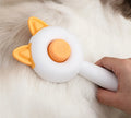 Self-cleaning pet grooming comb with massage function in greenish white or orange white colour options