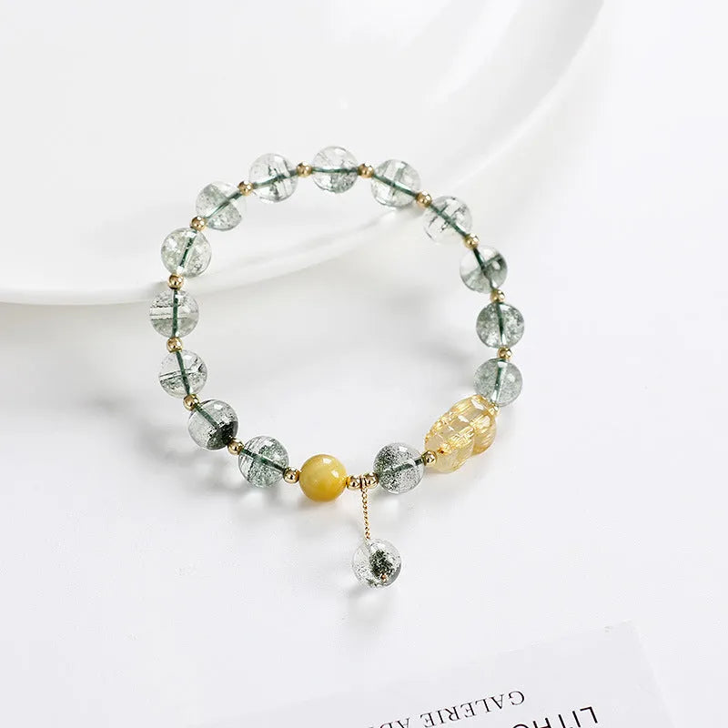 Green phantom quartz crystal bracelet with 8mm geometric beads and gold rutile inclusions