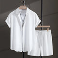 Men's white cotton blend short-sleeve shirt and shorts casual beach suit set laid flat.