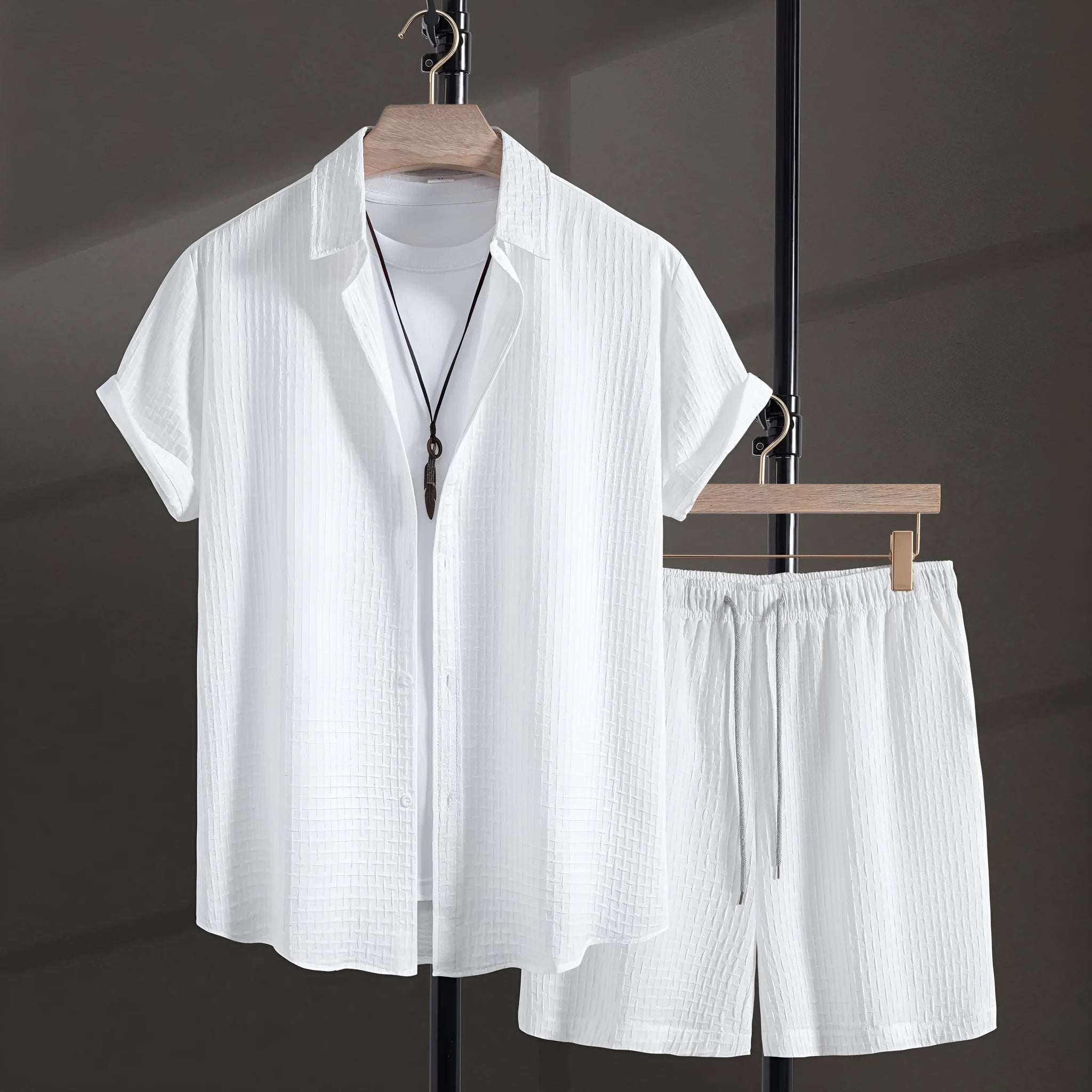 Men's white cotton blend short-sleeve shirt and shorts casual beach suit set laid flat.