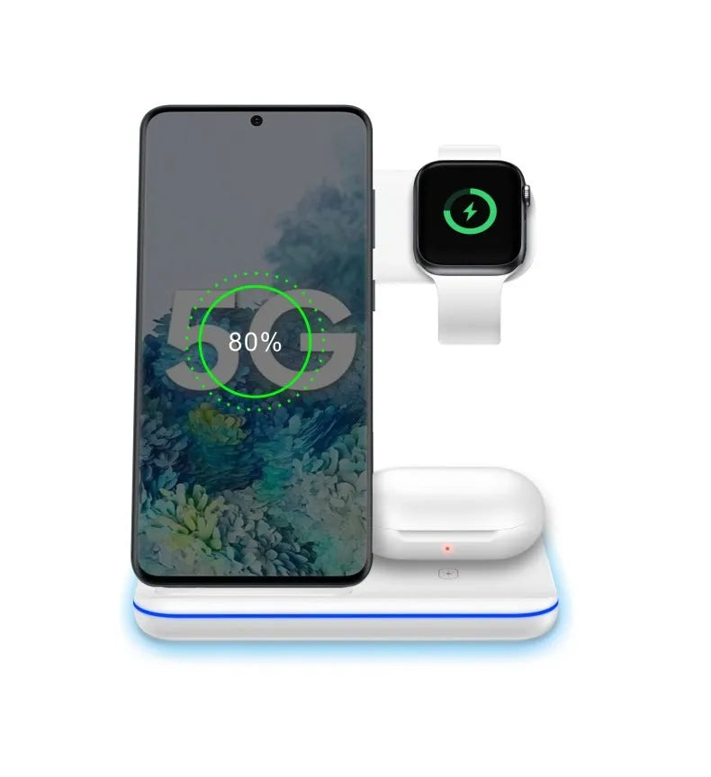 White three-in-one wireless charging stand for phone, watch, and headset on a desk.