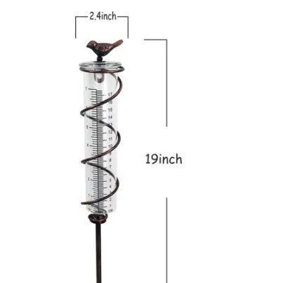 Cast iron bird rain gauge with glass measurement tube showing 0-800ml capacity and 1-20 scale