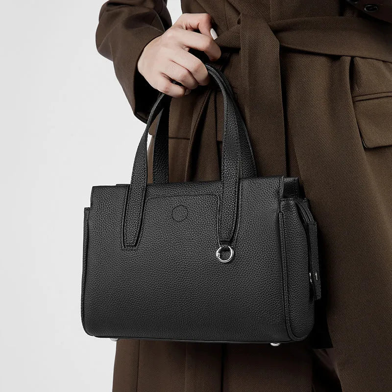 Genuine leather crossbody bag in horizontal square suitcase shape with shoulder strap