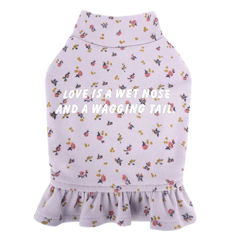 Bichon Frise dog wearing light purple floral undershirt skirt pet clothing