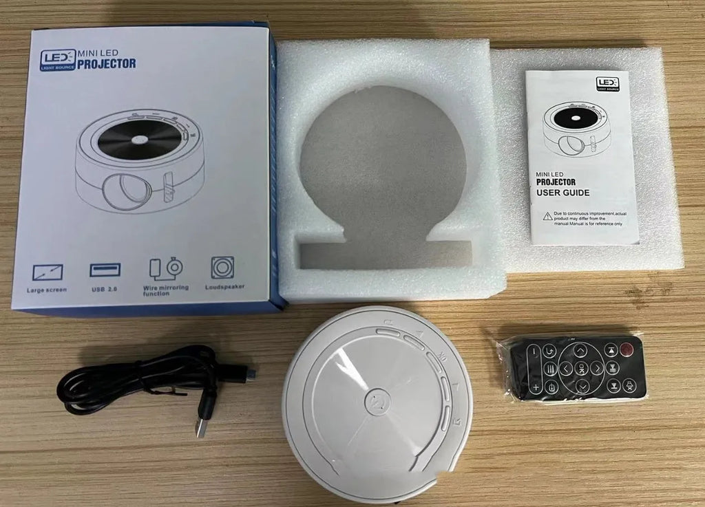 YT200 portable home LED projector with same screen connectivity in black, white, yellow and white, or blue and white colours measuring 110mm x 47mm