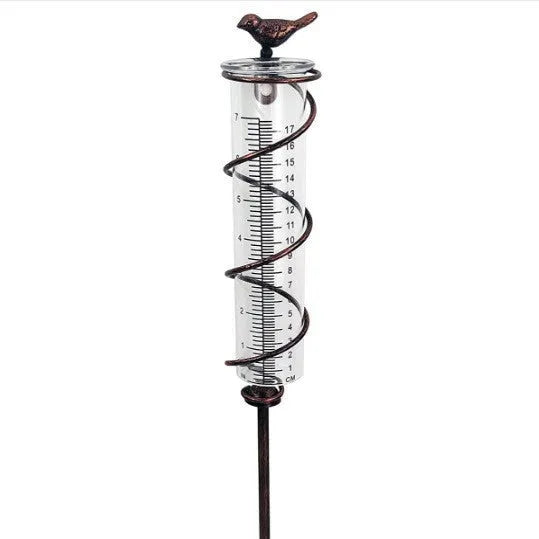 Cast iron bird rain gauge with glass measurement tube showing 0-800ml capacity and 1-20 scale