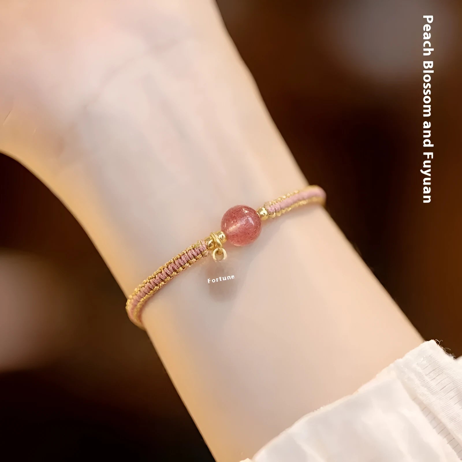 Adjustable red rope bracelet with sliding strawberry quartz bead in national tide style.