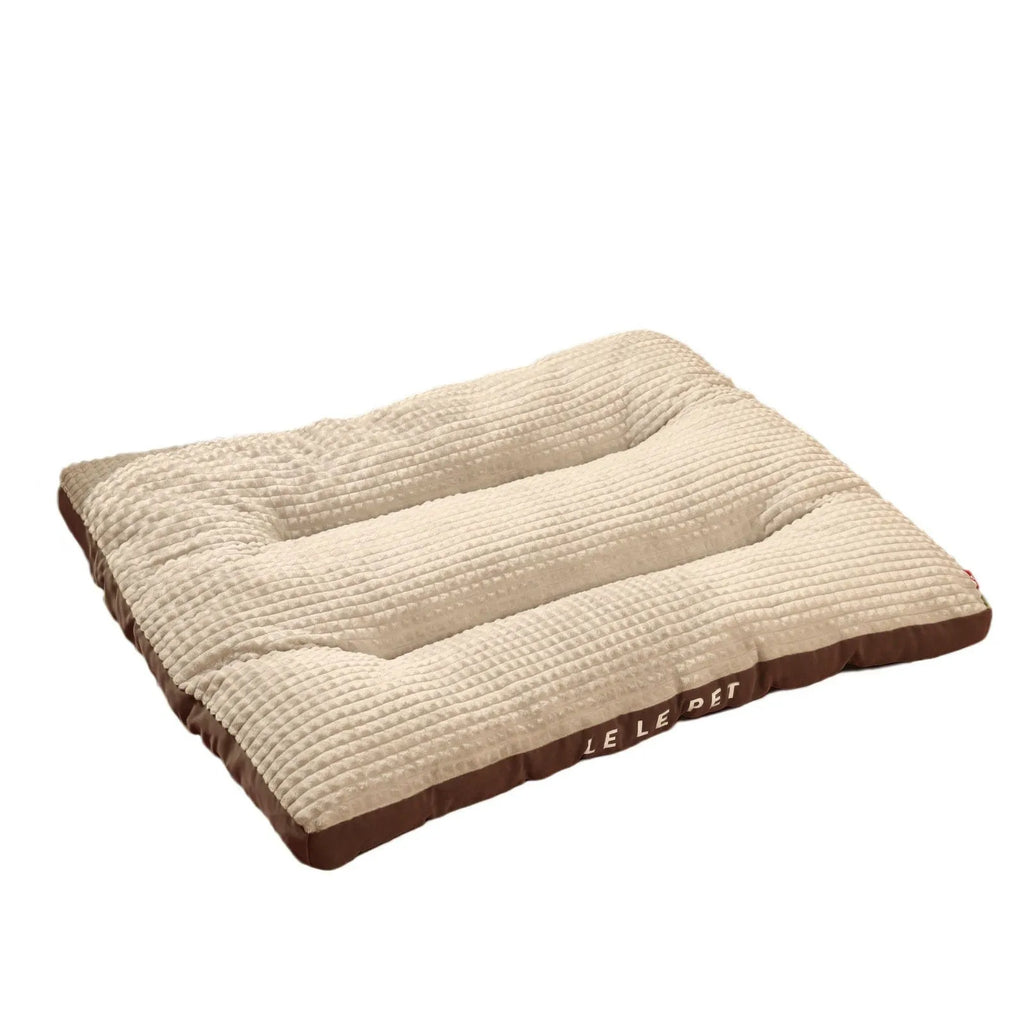 Detachable soft fleece dog bed in green, shown with blanket separated from the cushion base.