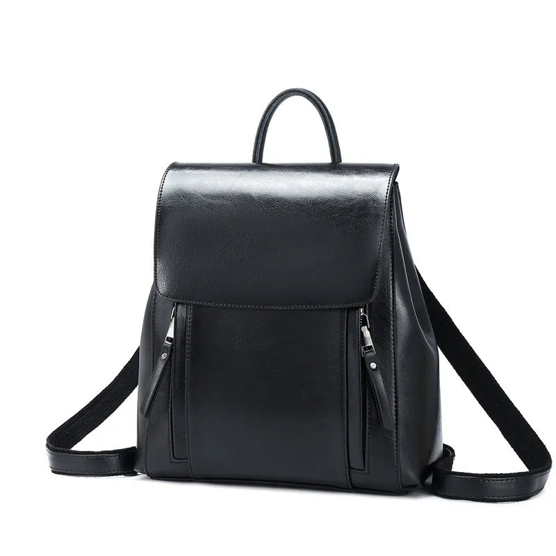 Large black genuine leather women's backpack with stitching detail and soft straps.
