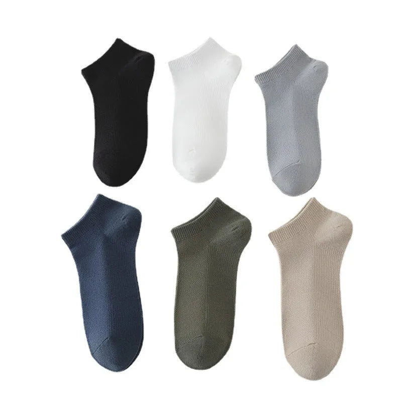 A pair of solid colour low-cut polyester boat socks laid flat, showcasing their simple design and one of the six available colour variants.
