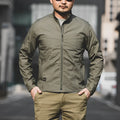 Men's tactical camouflage polyester coat in a camouflage pattern with functional pockets.
