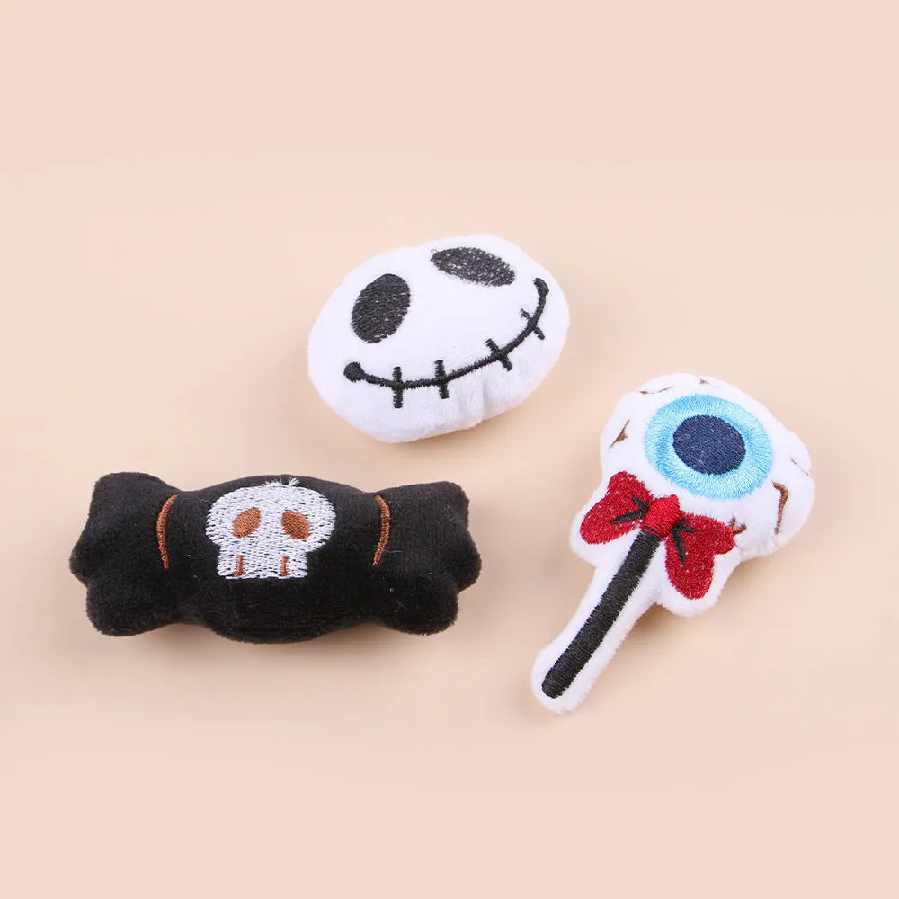 Plush cat teaser toy with feather wand in candy or skull design for small cats