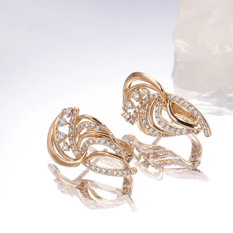 Gold geometric wing-shaped ear clips with micro inlaid stones on U-shaped copper clips