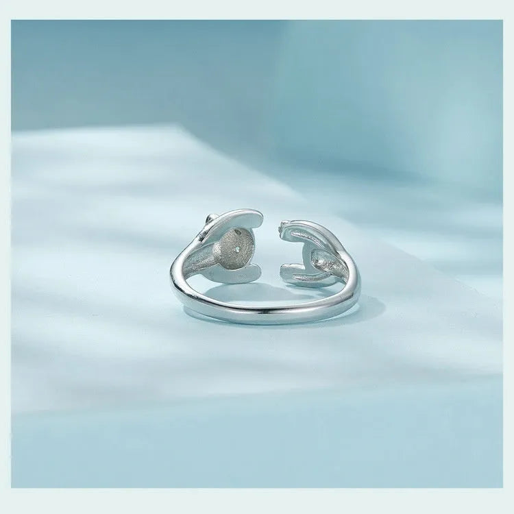 Adjustable sterling silver ring with a white gold plated panda design.