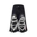 Black cropped wide-leg jeans with mid-high waist and distressed patch detail on micro-elastic denim