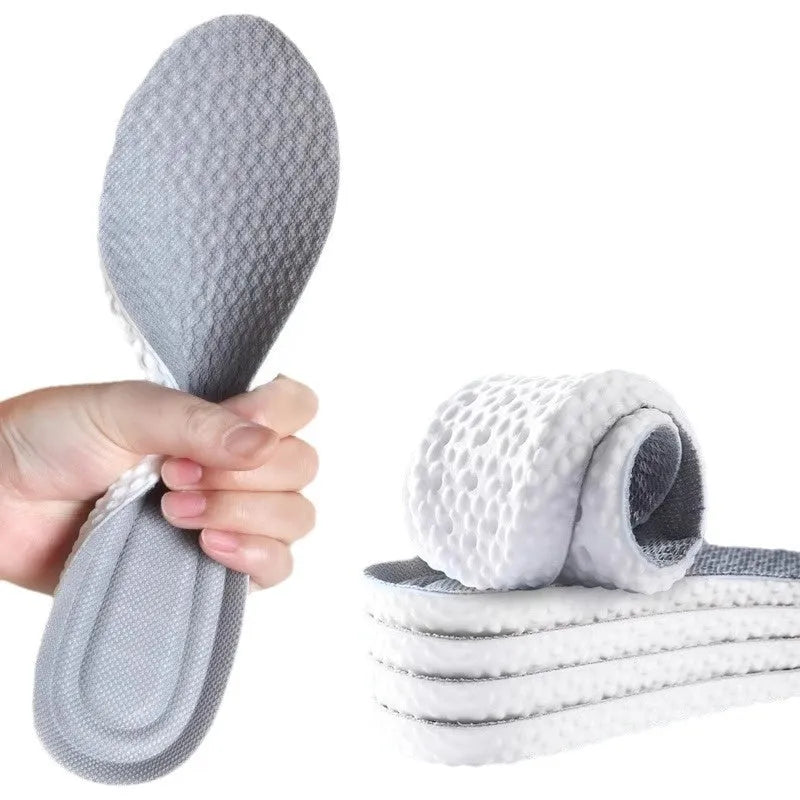 Grey, black, and orange cuttable breathable sports insoles made from PU foam.