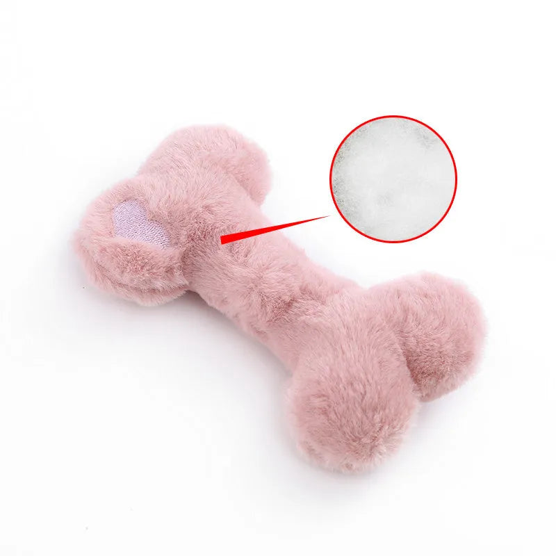Bone-shaped plush dog toy with hearts and 'Love' text, containing squeaker for interactive pet play