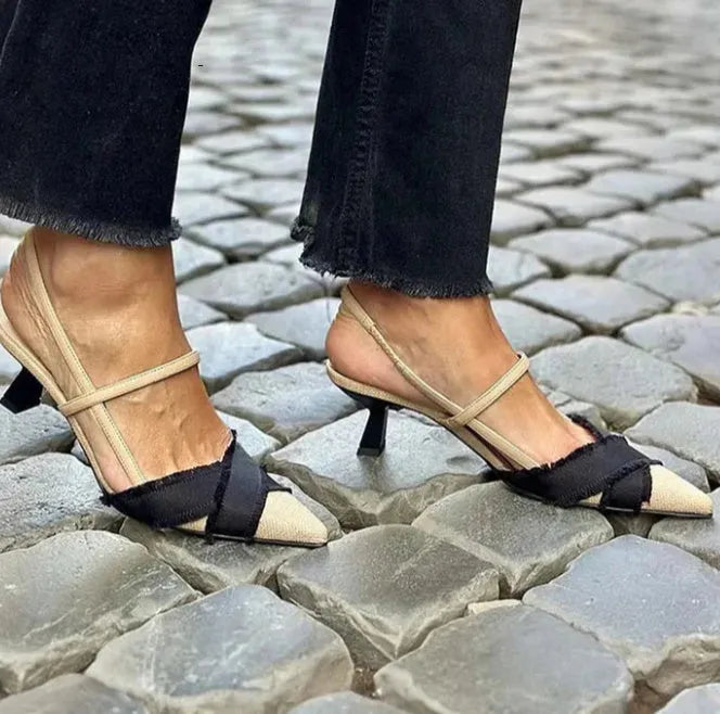 Women's apricot and black colour block pointed-toe stiletto sandals with a buckle strap.