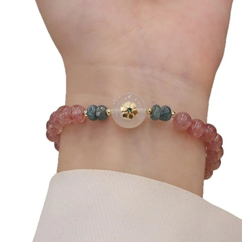 Strawberry quartz and blue water emerald pendant bracelet with round jade centrepiece and geometric diamond elements