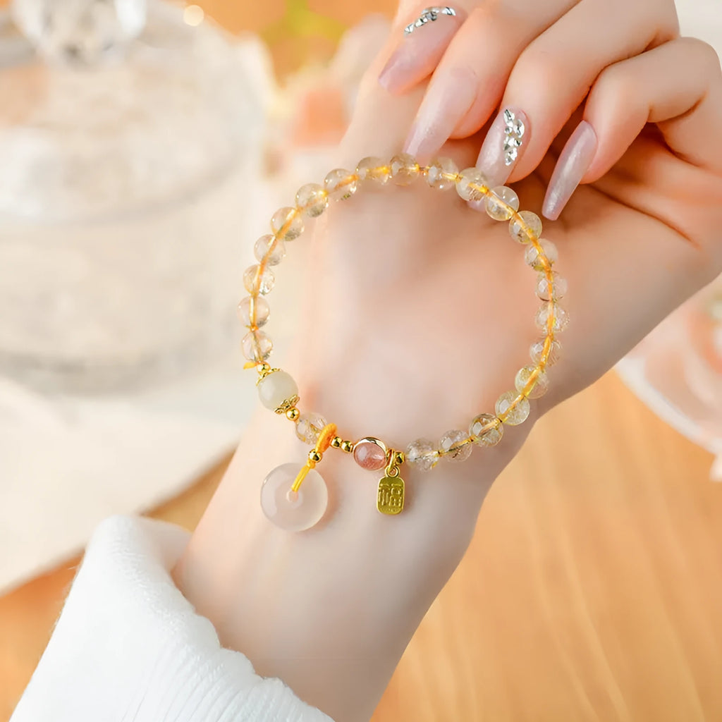 Gold rutilated quartz crystal bracelet with safety buckle and geometric pendant