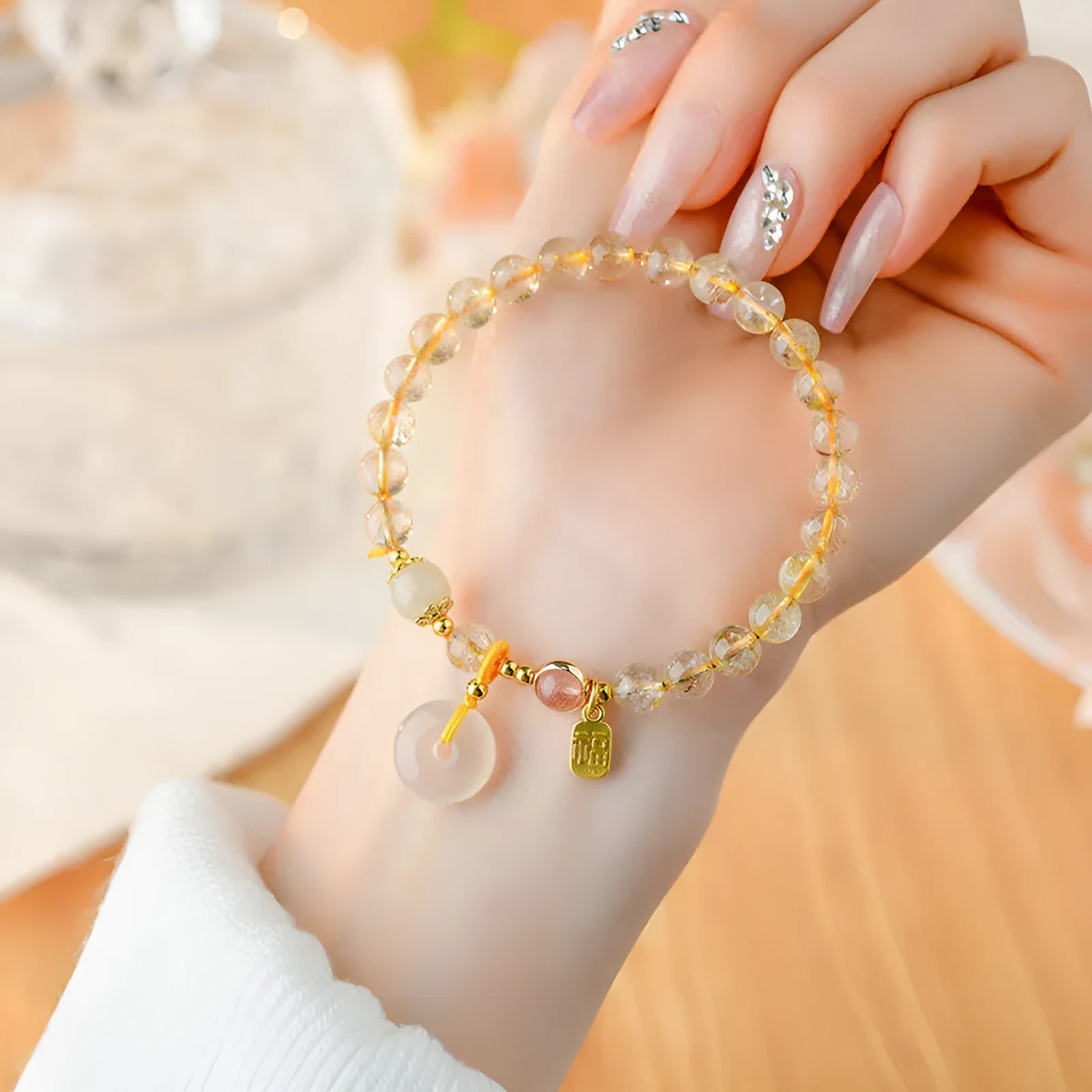 Gold rutilated quartz crystal bracelet with safety buckle and geometric pendant