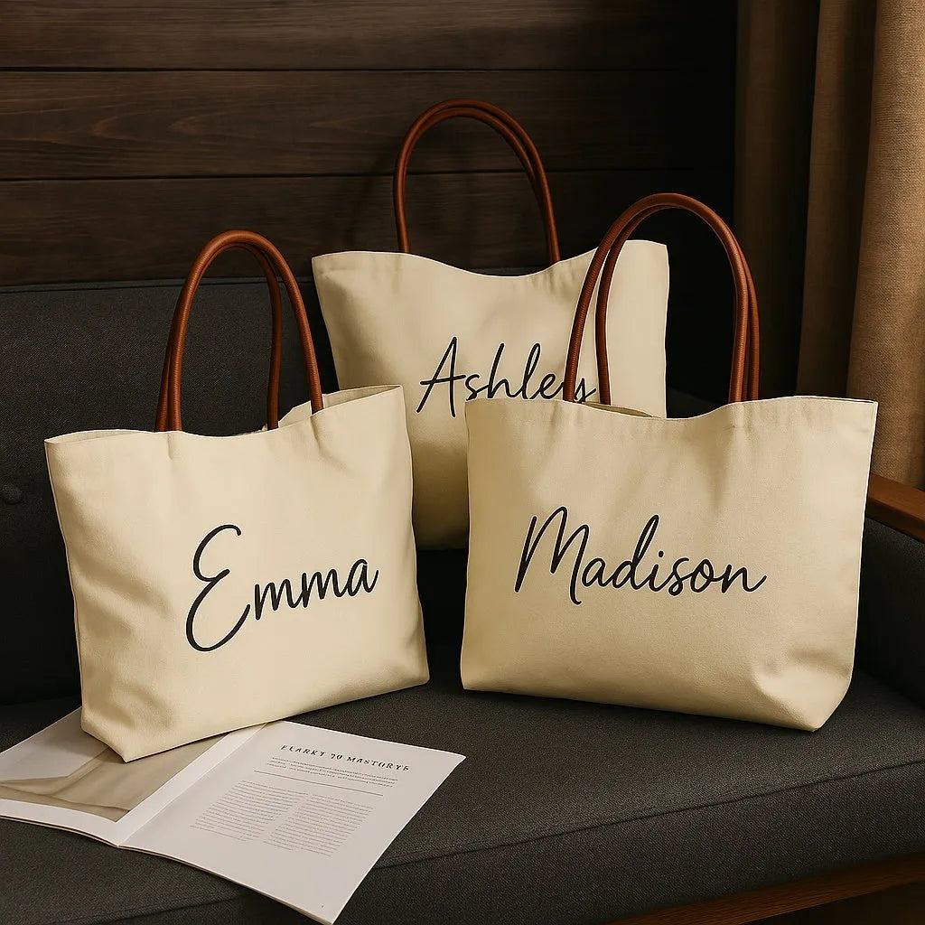 Beige white canvas tote bag with top handles and an internal zip pocket, shown with a book and keys.