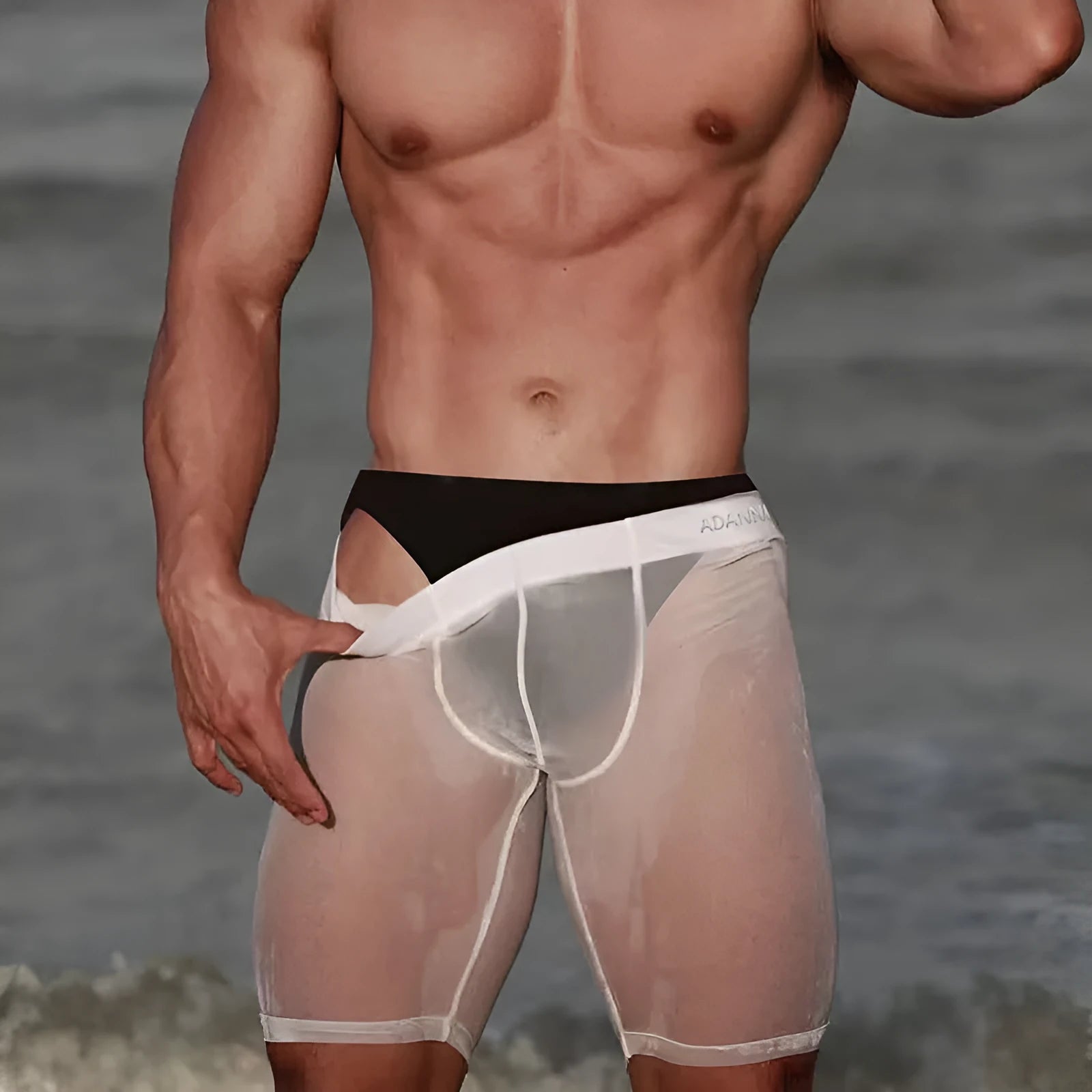 Men's black seamless mesh home shorts with a knitted texture and hip-lifting design.
