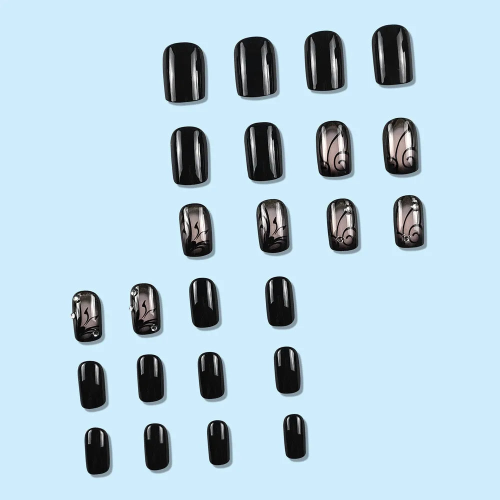 Dark Ins style black vine wearable nail tips set with jelly glue finish on a white background