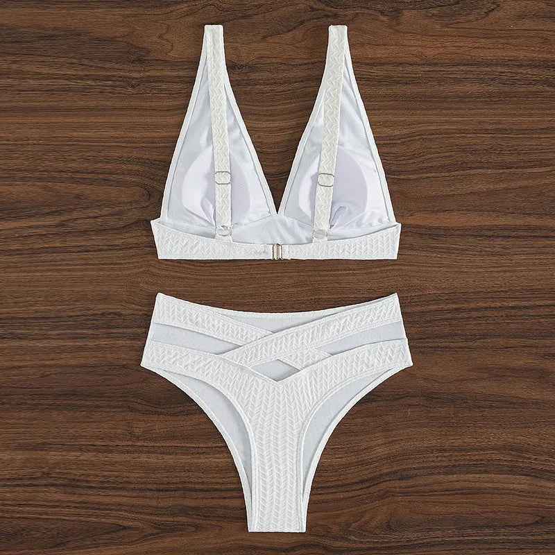 White women's backless two-piece bikini swimsuit set on a mannequin.